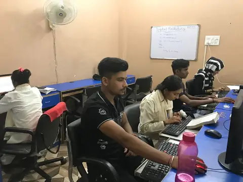 Students working on digital marketing projects in the Webultro Training computer lab