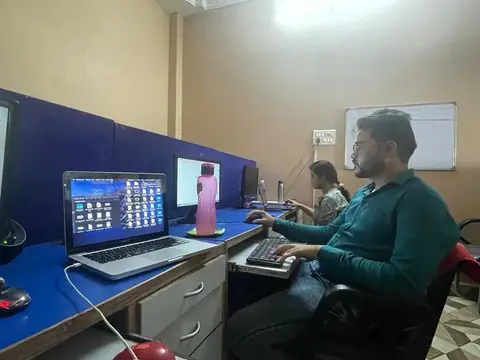 Student practising on a laptop and desktop at Webultro Training, Lucknow